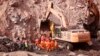 FILE — In this photo released by China's Xinhua News Agency, rescuers search a collapsed open pit coal mine in northern China's Inner Mongolia Autonomous Region, Feb. 23, 2023. An accident at a coal mine in China's Henan Province left at least 10 dead, state media said Saturday. 