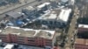 In this photo released by Xinhua News Agency, an aerial drone shows the dormitory with charred windows after a fire at the Yingcai School in Dushu Town, Fangcheng County, Nanyang city, in central China's Henan province on Jan. 20, 2024. 