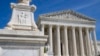 FILE - The US Supreme Court is seen, with a carving of Justice in the foreground, April 19, 2023, in Washington.