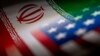 Bendera Iran dan AS terlihat berdampingan dalam sebuah ilustrasi. AS akan segera memberlakukan sanksi baru terhadap program rudal dan pesawat tak berawak atau drone Iran setelah Teheran menyerang Israel. (Foto: REUTERS/Dado Ruvic)