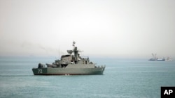 In this picture taken on April 7, 2015, and released by the semi-official Fars News Agency, Iranian warship Alborz, is seen in the Strait of Hormuz. Tehran has threatened to close the waterway to U.S. and allied vessels.