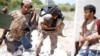 A fighter of Libyan forces allied with the U.N.-backed government runs for cover with another fighter while carrying a wounded fighter during a battle with Islamic State fighters in Sirte, Libya, July 31, 2016. 