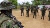 ARCHIVO - Guerrilleros del Frente 33 de las disidencias de las FARC, con quien se enfrenta el ELN en el Catatumbo. Fotografía tomada el 12 de diciembre de 2024 en el Catatumbo, Colombia