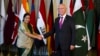 Indian Foreign Minister Sushma Swaraj (L) shakes hand with Pakistan's top adviser for foreign affairs, Sartaj Aziz, prior to their meeting in Islamabad, Pakistan, Dec. 9, 2015.