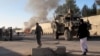 FILE - Smoke bellows after a suicide car bomb blast attacked a military convoy in Lashkar Gah, Helmand province, Afghanistan, Nov. 15, 2015.