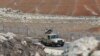 FILE - Jordanian soldiers patrol along the eastern Jordan-Syria border, in al-Washash, Mafraq governorate, Jordan, Thursday, Feb. 17, 2022. Jordan is believed to have carried out an airstrike against drug traffickers in Syria on Jan. 18, 2024.