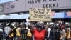A demonstrator protests against abuses by the Special Anti-Robbery Squad (SARS) at the Lekki toll Plaza in Lagos, Nigeria, on Oct. 12, 2020.