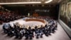 Members of the Security Council vote on a resolution drafted by Australia, which lost 28 citizens in a Malaysian passerger plane crash in Ukraine, during meeting at United Nations headquarters in New York, July 21, 2014. 