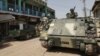 FILE - Pakistani army soldiers patrol in Miran Shah bazaar after driving out militants from the tribal region of North Waziristan along the Afghanistan border. 