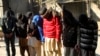 Pakistani suspects allegedly affiliated with the Islamic State group, wait to appear in the anti-terrorist court, in Gujranwala, Pakistan, on Dec. 29, 2015.