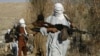 FILE - Armed Taliban fighters are seen at an undisclosed location in Nangarhar province, Afghanistan, Dec.13, 2010. A senior Afghan Taliban commander was killed Thursday by Afghan security forces in Nangarhar's Surkhrod district.