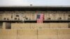 FILE - A U.S. flag hangs off of a housing unit inside of Bagram Air Base in the Parwan province of Afghanistan. NATO said a suicide blast has killed six of its soldiers and wounded three others near Bagram airbase, Dec. 21, 2015.