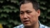 FILE - Chinese human rights lawyer Pu Zhiqiang faces trial Monday for allegedly using social media to incite hatred and violence. He's shown in Beijing, July 20, 2012.