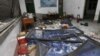 A damaged room in a residential building is seen after several locations were targeted with parcel bombs in the southwestern city of Liuzhou, Guangxi province, Sept. 30, 2015.