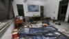 A damaged room in a residential building is seen after several locations were targeted with parcel bombs in the southwestern city of Liuzhou, Guangxi province, Sept. 30, 2015.