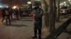 Afghan security forces stand guard near a terrorist attack site, close to the Spanish embassy, in center of Kabul, Afghanistan, Dec. 11, 2015. 