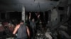Palestinians search for survivors and bodies in the rubble of a mosque destroyed in an Israeli airstrike in Deir al-Balah, Oct. 6, 2024.